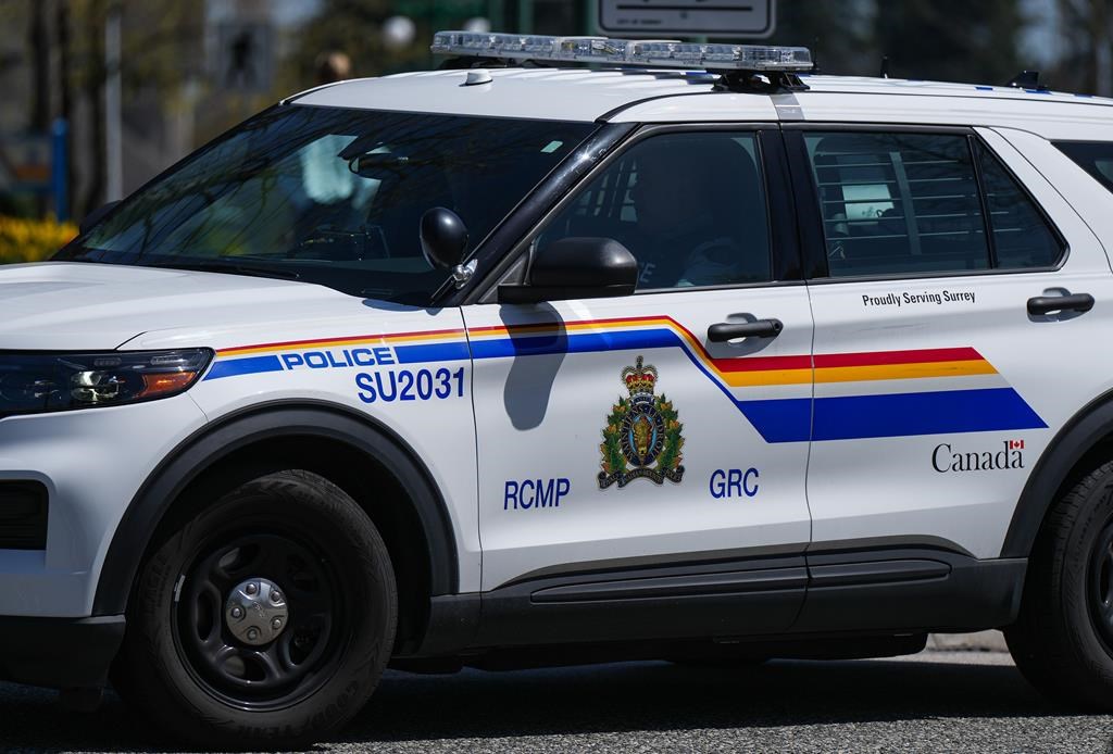 A Surrey RCMP officer drives a police vehicle in Surrey, B.C., on Friday, April 28, 2023.