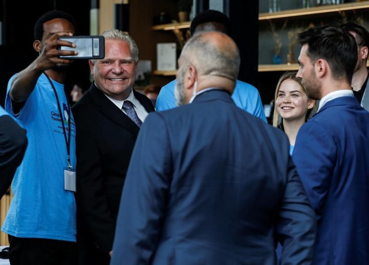 Doug Ford, Premier of Ontario, poses for photos with staff as he arrives at the Canadian premiers and National Indigenous Organizations meeting in Winnipeg, Monday, July 10, 2023. Ford says he did not see or approve a list of lawyers, including members of cabinet and prominent Conservatives, his attorney general has given the honorary title of King's Counsel. 