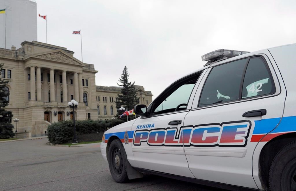 A Regina police car idles at the legislative building in Regina on Wednesday, Oct. 22, 2014.