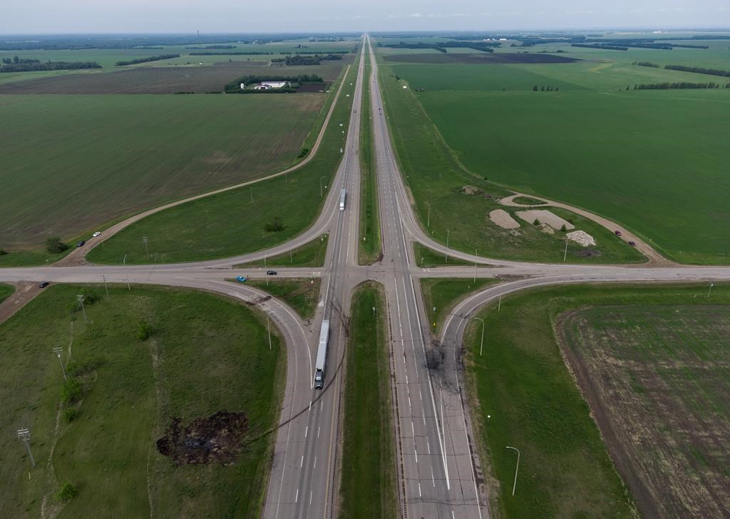 A scorched patch of ground where a bus carrying seniors ended up after colliding with a transport truck is seen on the edge of the Trans-Canada Highway where it intersects with Highway 5, near Carberry, Man., on Friday, June 16, 2023. THE CANADIAN PRESS/Darryl Dyck.