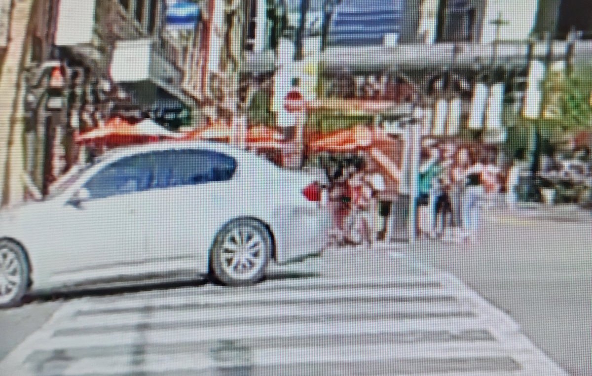 An image captured by a CPS body-worn camera shows a silver sedan police believe was involved in a pedestrian hit-and-run on June 27 in downtown Calgary.