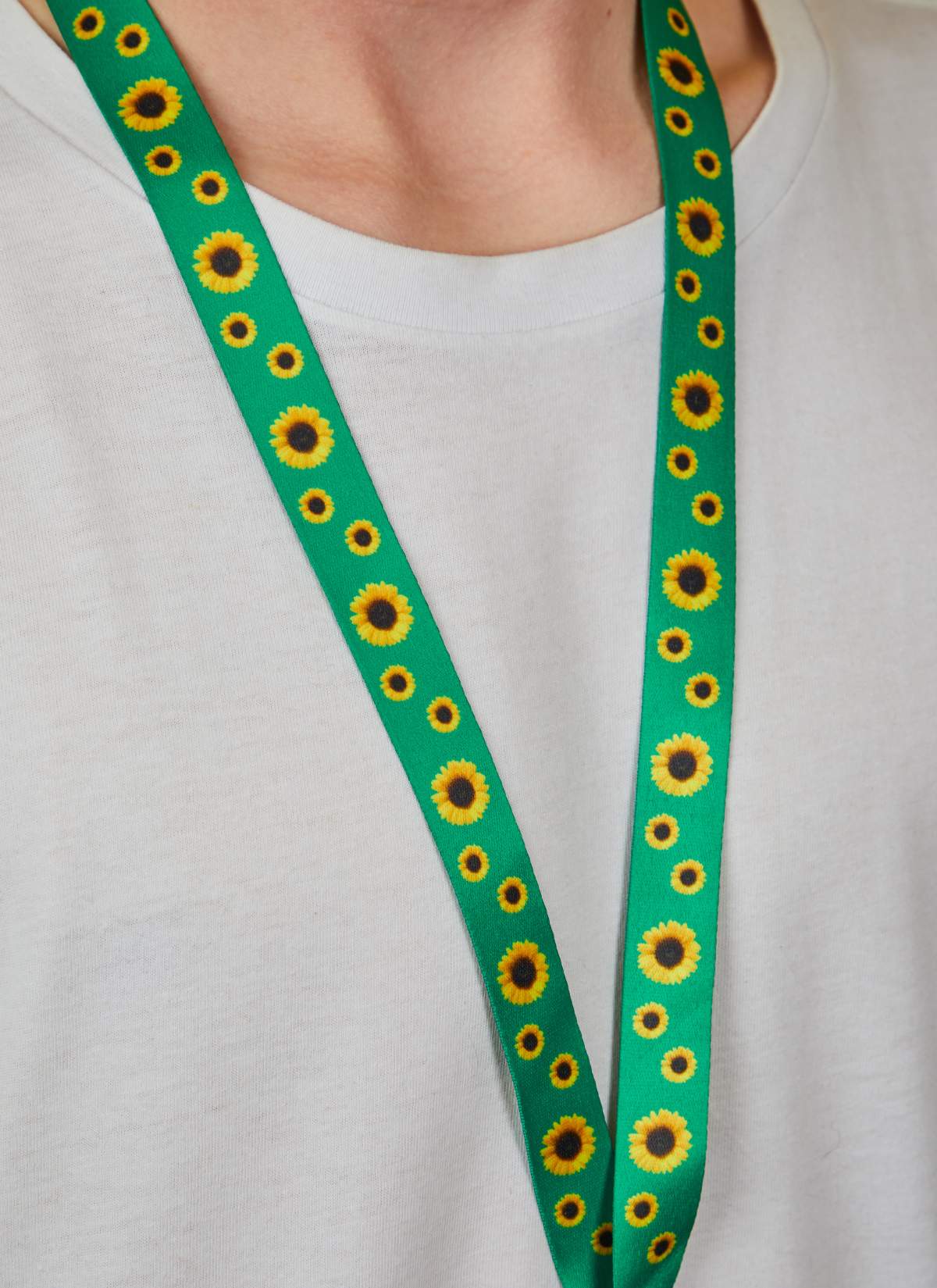 Someone wearing the green sunflower lanyard.