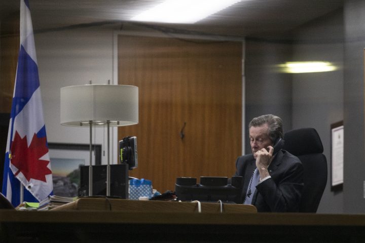 Toronto Mayor John Tory makes a telephone call from his office after the Toronto budget meeting, on Wednesday, February 15, 2023. 