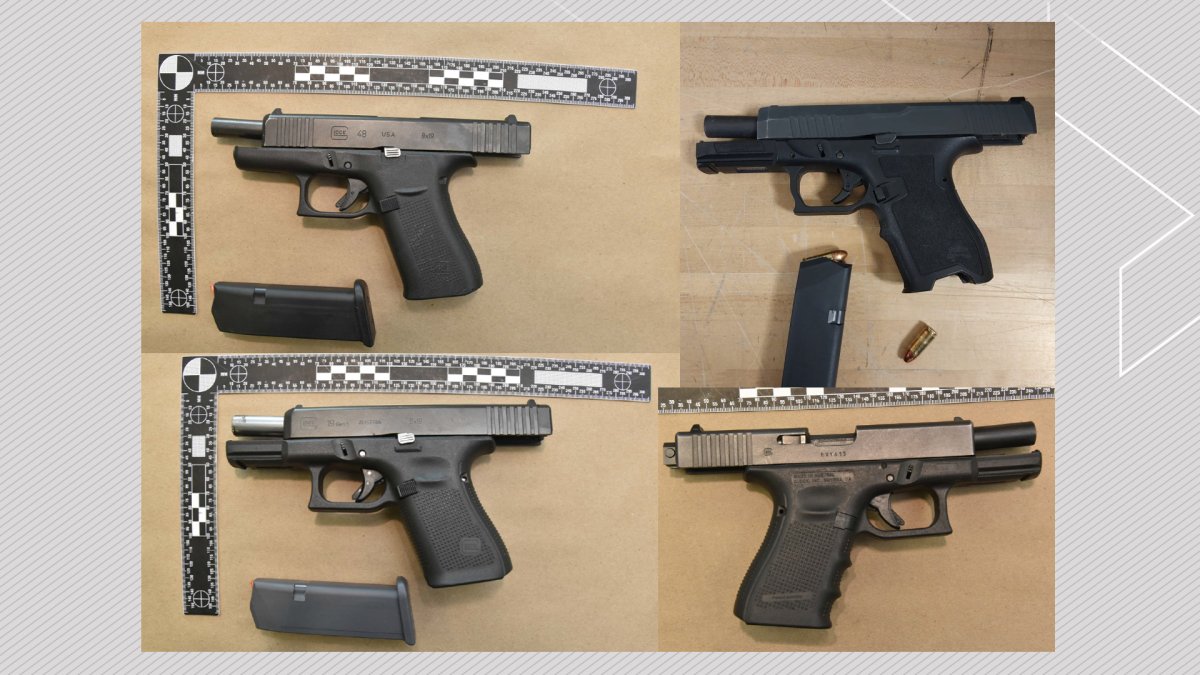 Four handguns seized by Calgary Police Service officers in July 2023.