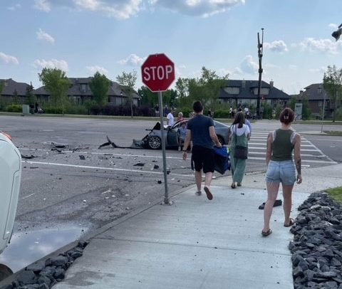 Flipped vehicle in crash on Windermere Blvd. in south Edmonton on Wednesday, July 19, 2023.