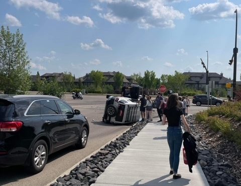 Flipped vehicle in crash on Windermere Blvd. in south Edmonton on Wednesday, July 19, 2023.