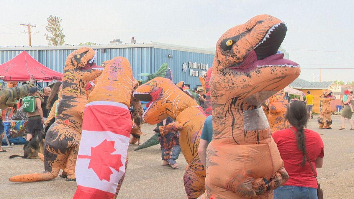 The town of Dundurn is making its mark by breaking last year's record of the largest gathering of people dressed in inflatable dinosaurs.