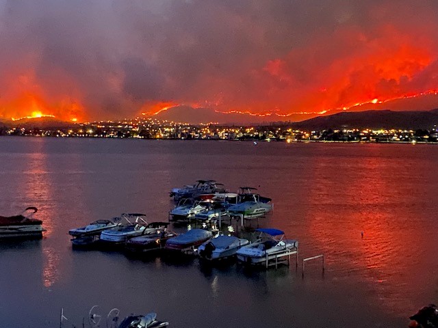 Flames light up the sky over Osoyoos, B.C. on Saturday July 29, 2023.