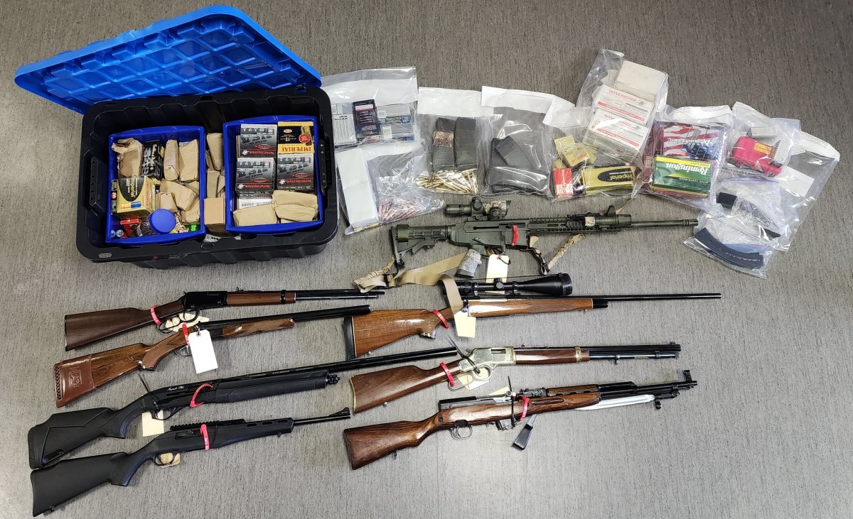 Photo of the firearms and illegal firearms magazines police seized July 11.