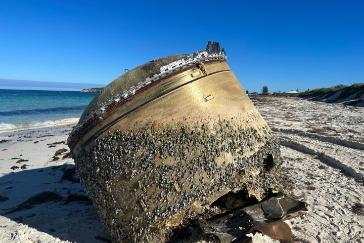 Mysterious giant metal cylinder washes up on Australian beach