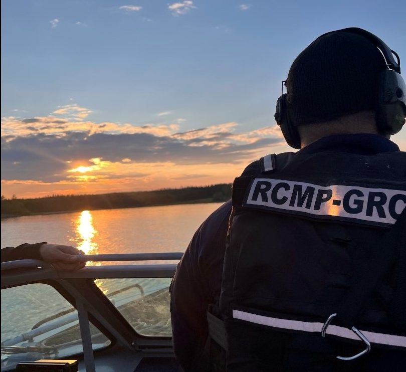 Nelson House RCMP officers returning to shore after rescuing stranded girls on a dock that broke free on Footprint Lake in Nisichawayasihk Cree Nation.