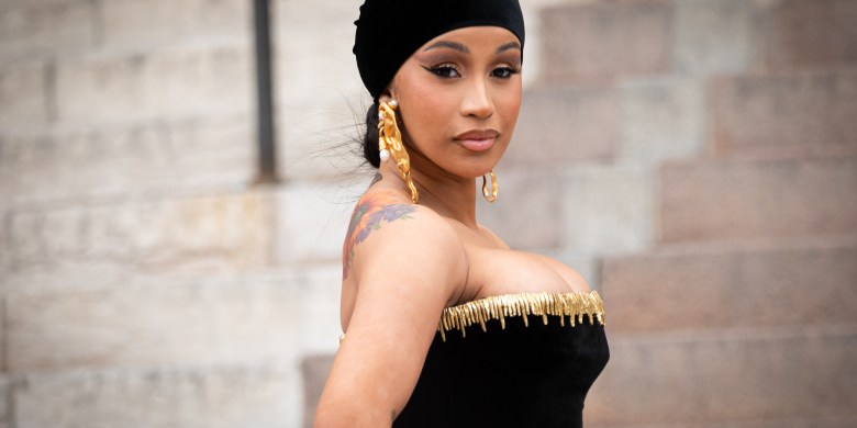 Cardi B hurls microphone at fan who threw drink at her during show
