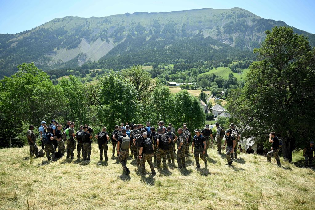 French gendarmes take part in a search operation for two-and-a-half-year-old Emile who is reported missing for two days, on July 10, 2023 in the French southern Alps village of Le Vernet. Emile was last seen playing in the garden at his grandparents' house on July 8, 2023.