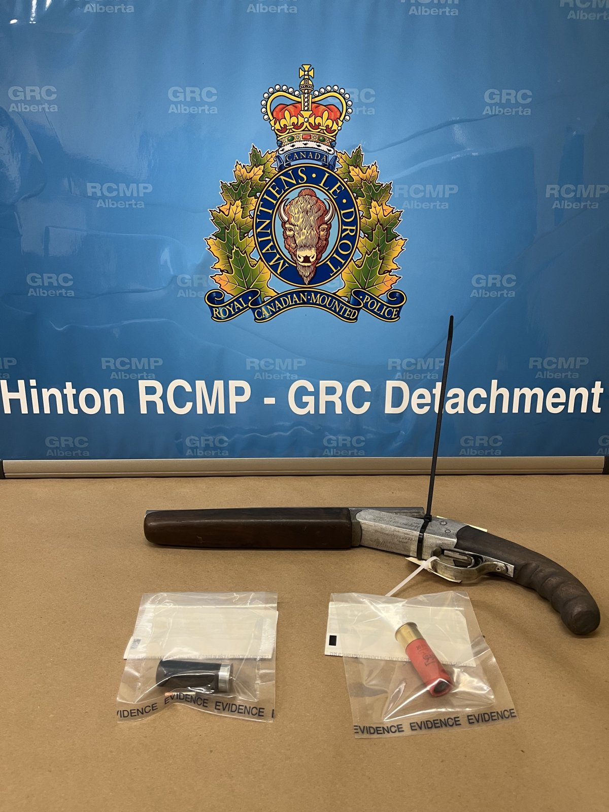 Photo of the shotgun and ammunition Hinton RCMP seized during an arrest on July 6.