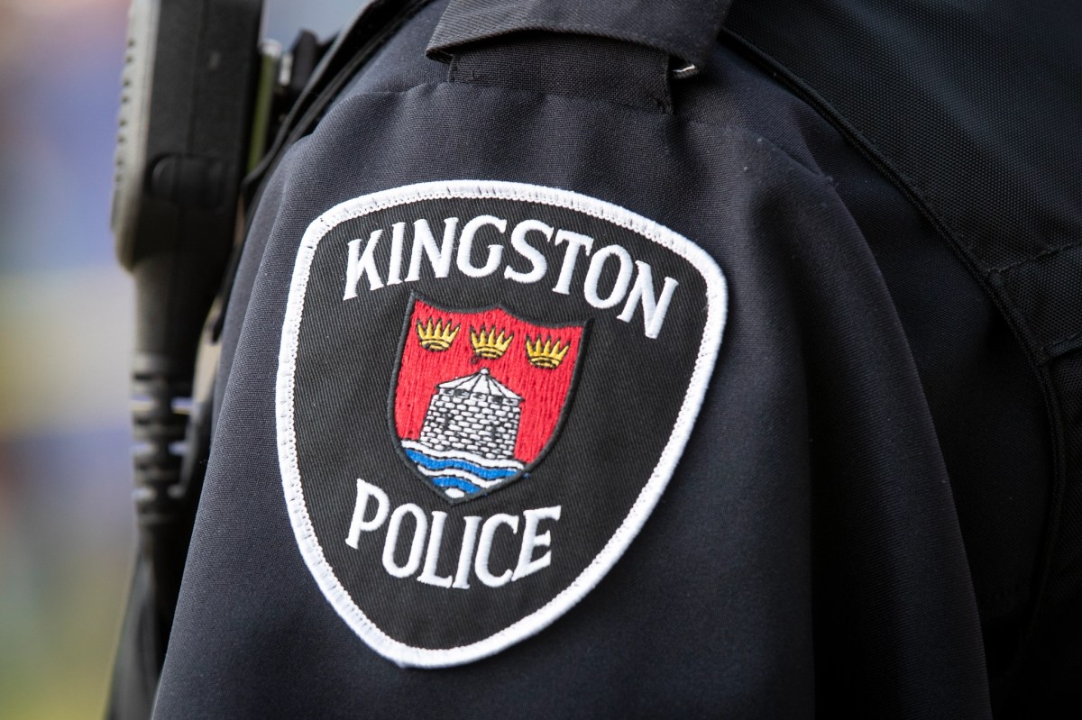 The Kingston Police Crest on the shoulder of a police uniform.