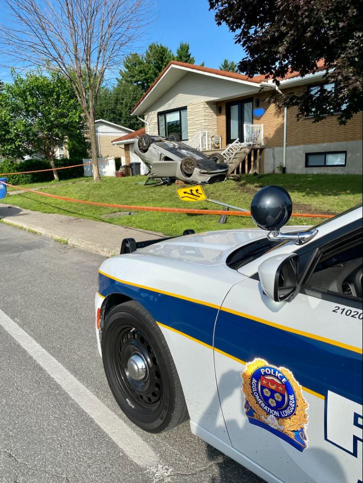 Car crashed onto front lawn in Brossard. 