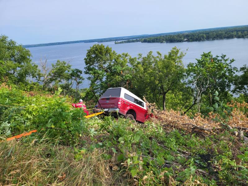OPP say Prince Edward County firefighters were able to secure a pickup truck and save an 88-year-old man after he drove the truck off a cliff in Lake on the Mountain Provincial Park. 
