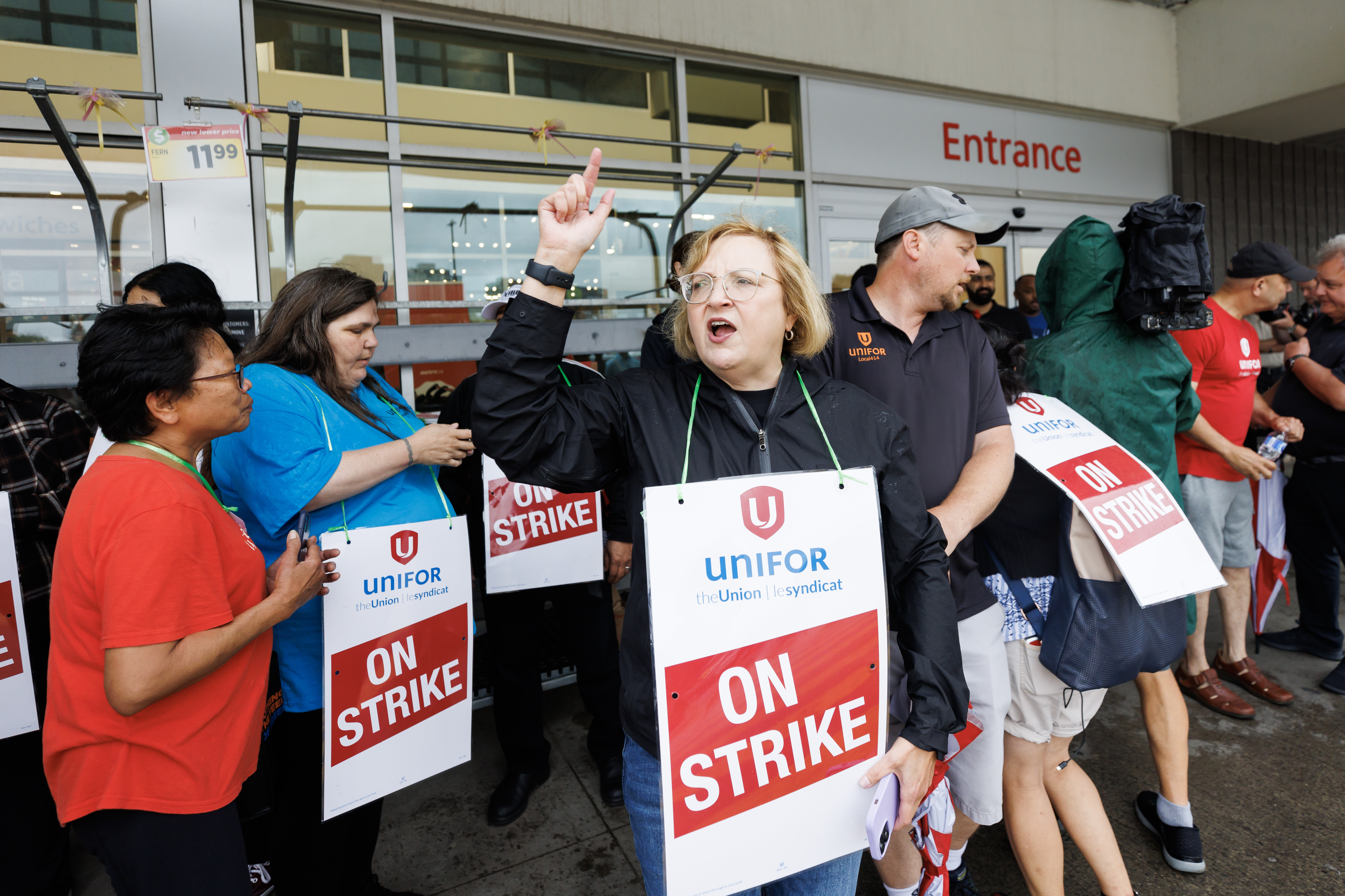 Lana Payne, the Unifor National president, shouts alongside workers at a picket line outside a Metro grocery store in Toronto as workers rejected a tentative deal triggering a strike of nearly 3,700 grocery store workers in the Greater Toronto Area, Saturday, July 29, 2023.