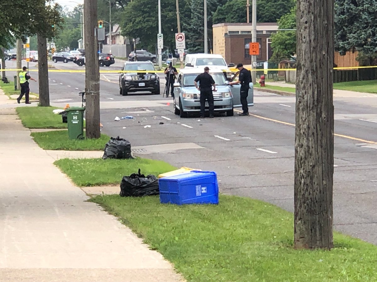 Collision reconstruction investigators at the scene at Fennell Avenue just west of Upper Wellington Street in Hamilton on July 25, 2023.
