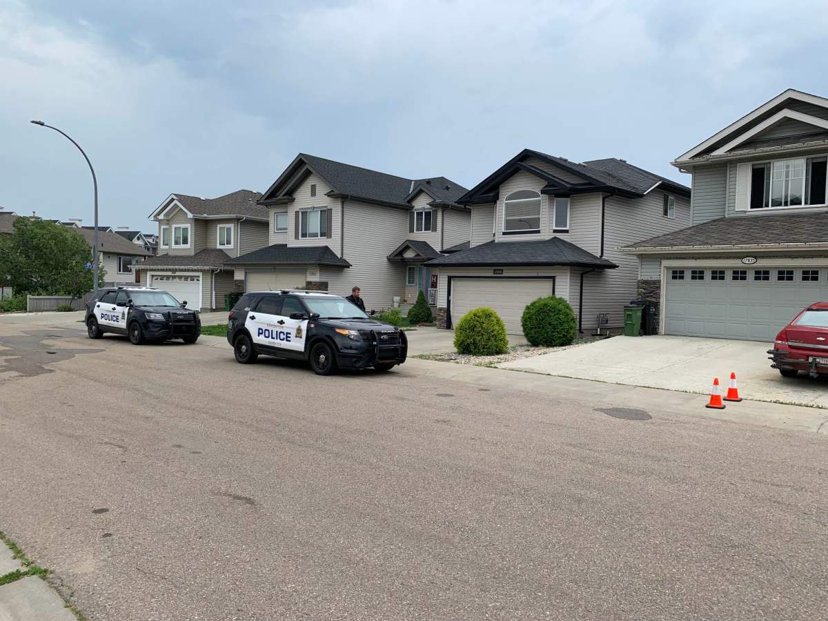police cars outside a residential home.