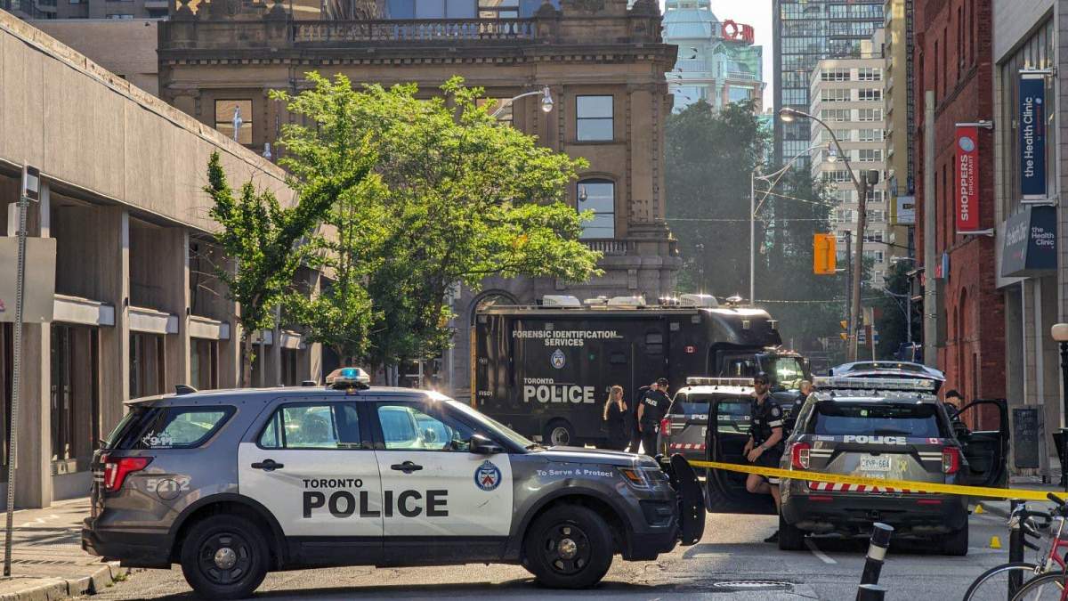 Toronto police on scene following a double shooting near Bloor and Yonge streets on July 10, 2023.