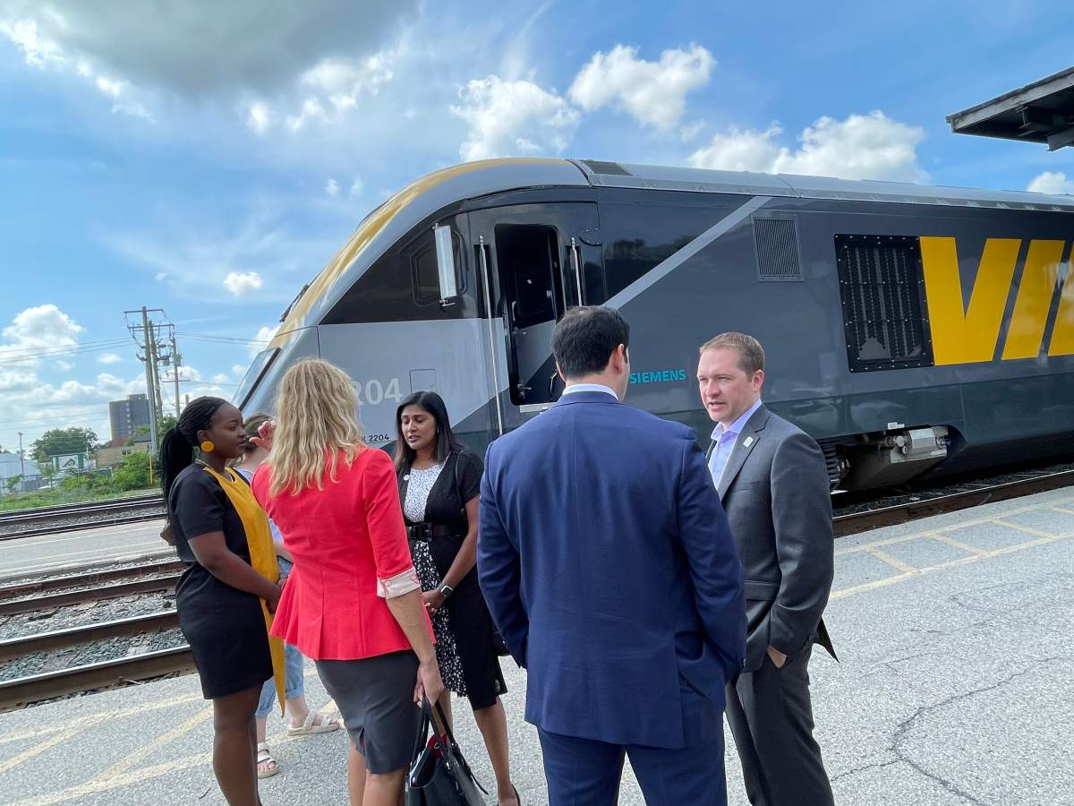Local and Via Rail officials speak in front of a new Via Rail train part of the upcoming replacement fleet at London Station on June 11, 2023.