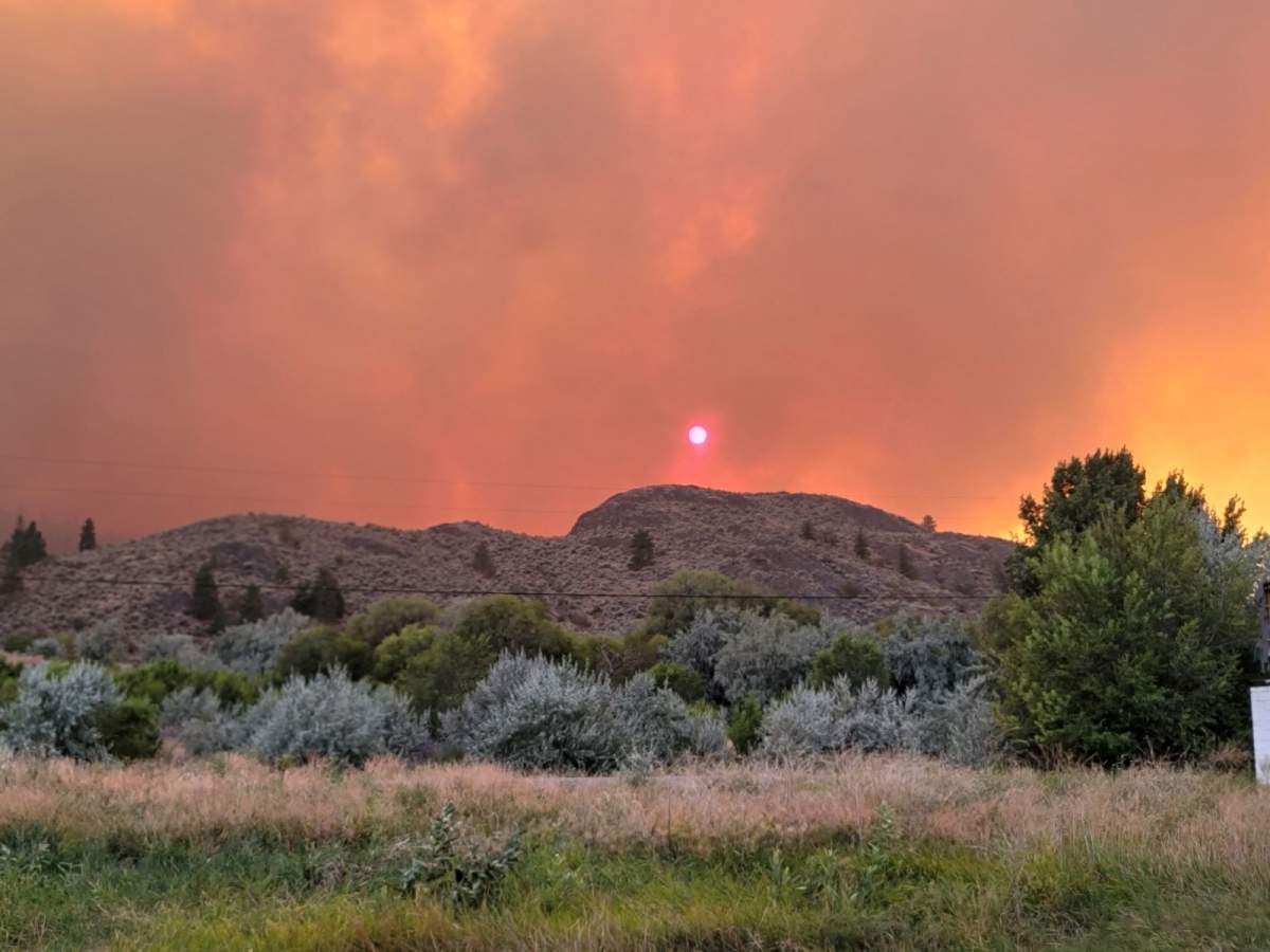 Smoke from a wildfire burning near Osoyoos, B.C., filters out the sun on Saturday.