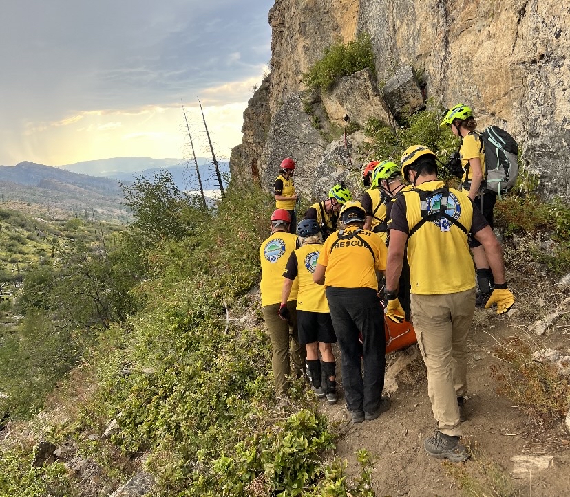 Rescue workers come to the injured climber's aid Friday at the John’s Family Nature Conservancy Regional Park. The climber fell 30 feet when his equipment failed.