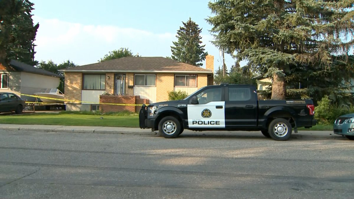 A CPS unit and police tape outside of a Bowness home on July 16, 2023 during the investigation into a suspicious death.