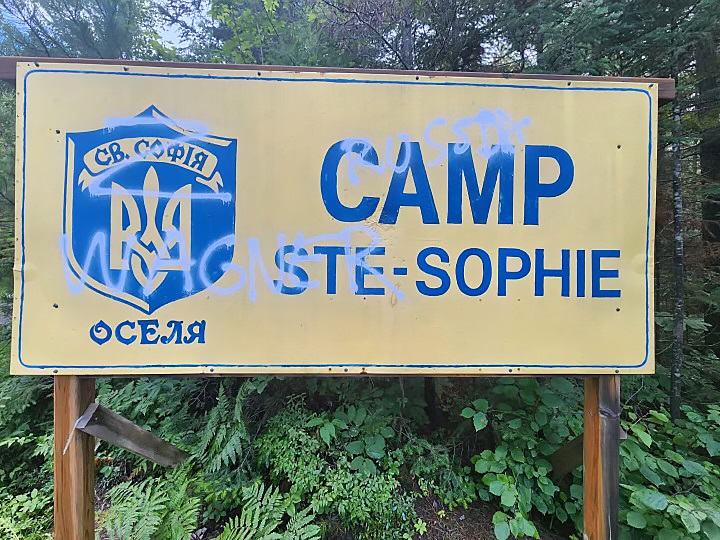 Officials who run a summer camp north of Montreal for Ukrainian children say one of its signs has been vandalized with pro-Russian graffiti as shown in this image provided by Evgeni Dashkevich.