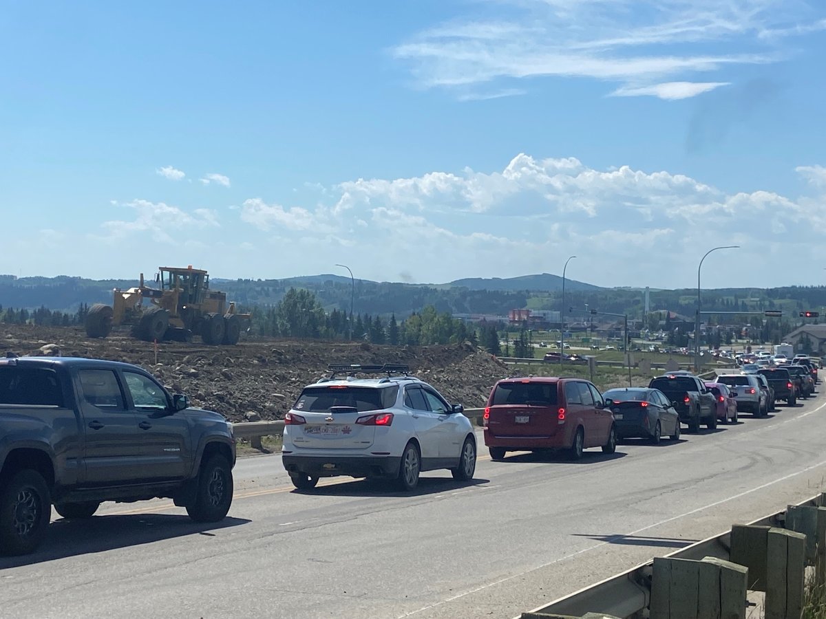 Work continues on the new interchange at Highway 1A and Highway 22 in Cochrane .