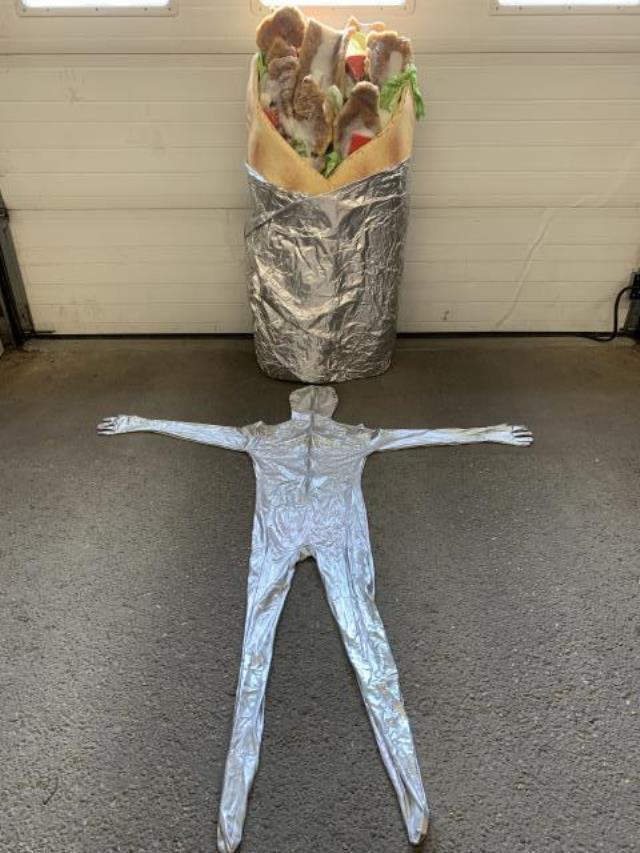 A head-to-toe body suit is laid out in front of the donair costume.