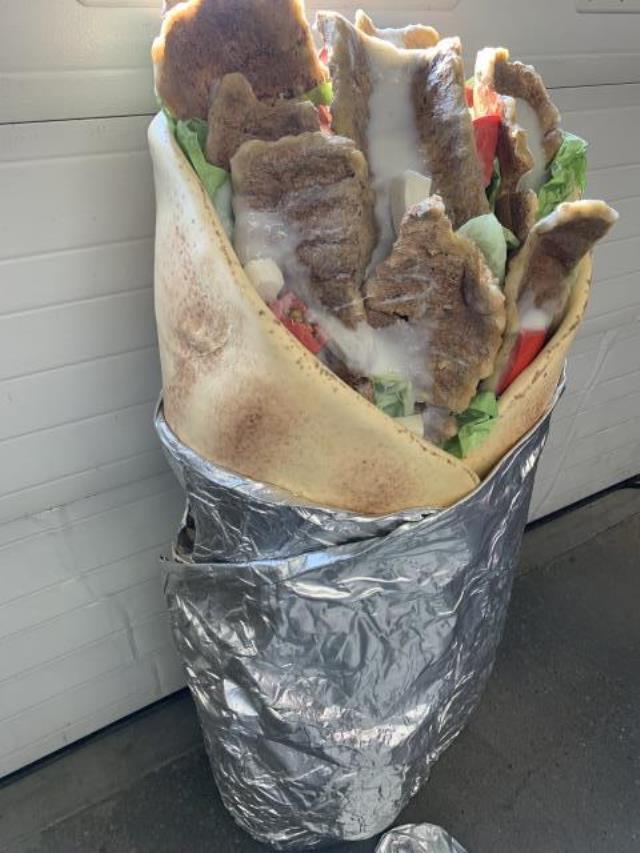 Donair meat, sauce, and lettuce are some of the toppings included in the costume.