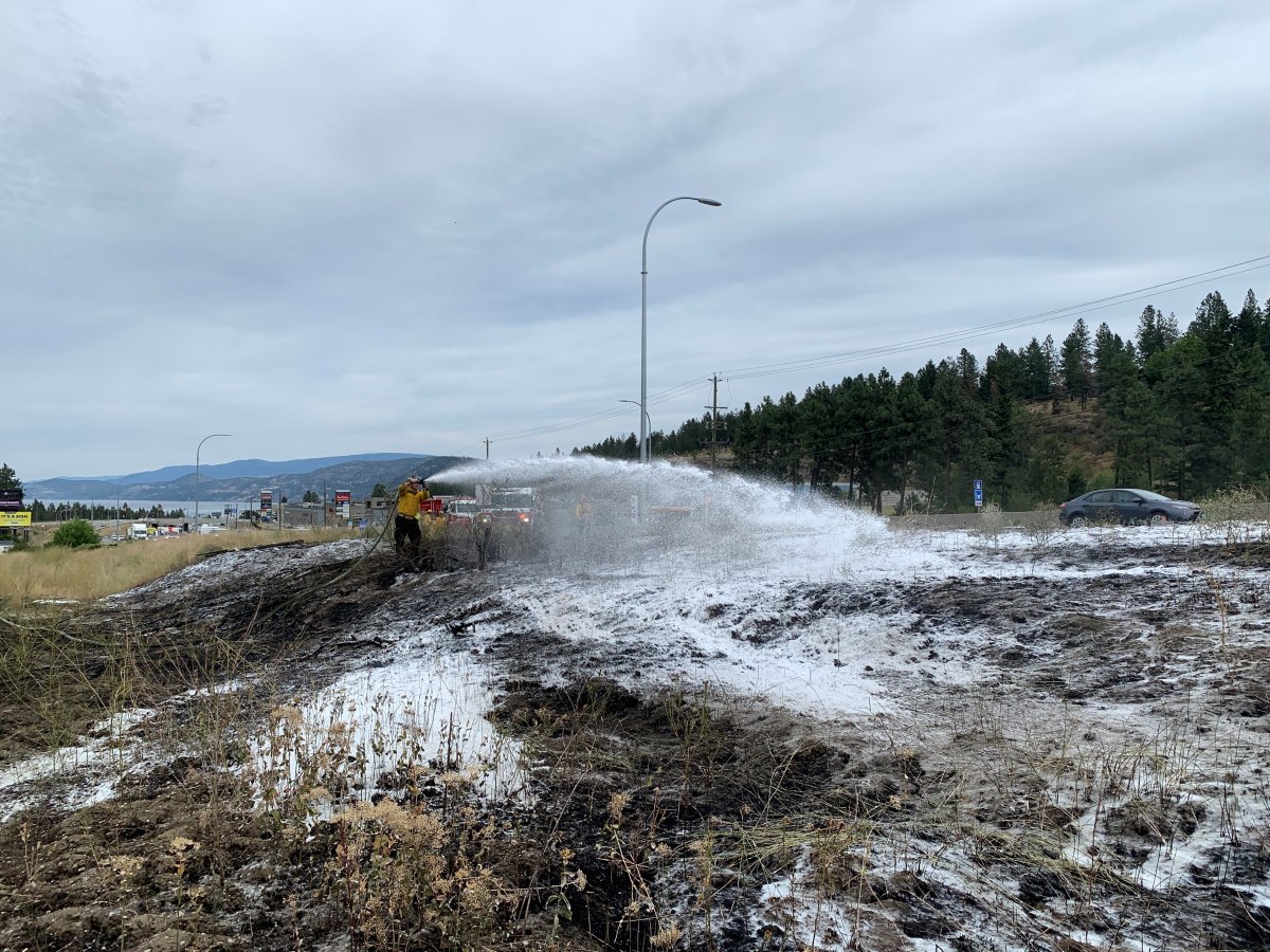 A layer of white foam is all that remains of three grass fires that were sparked along Highway 97, in West Kelowna on Monday. .