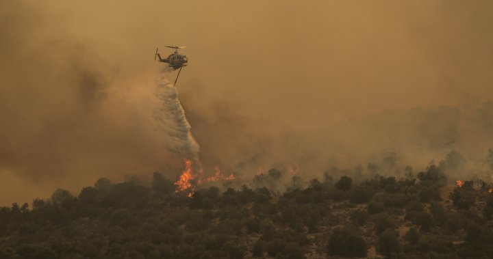 Greece wildfires rage amid high heat as EU pledges more assistance