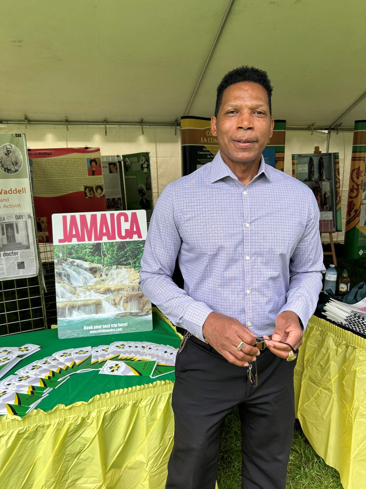 Dwayne Provo stands in front of an exhibit during the day's events.