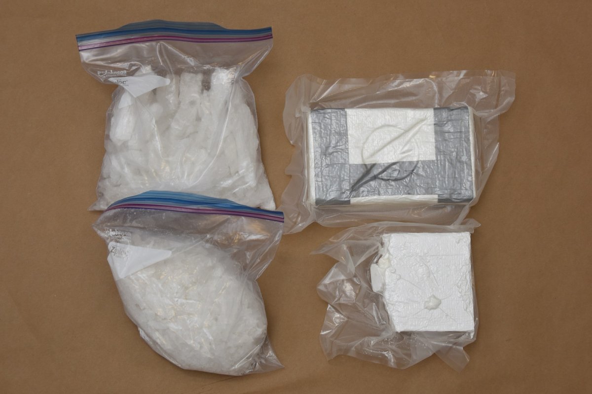 Police say they seized approximately 1.5 kilograms of suspected cocaine, two kilograms of suspected methamphetamine, approximately $33,000 in cash and other items related to drug trafficking.