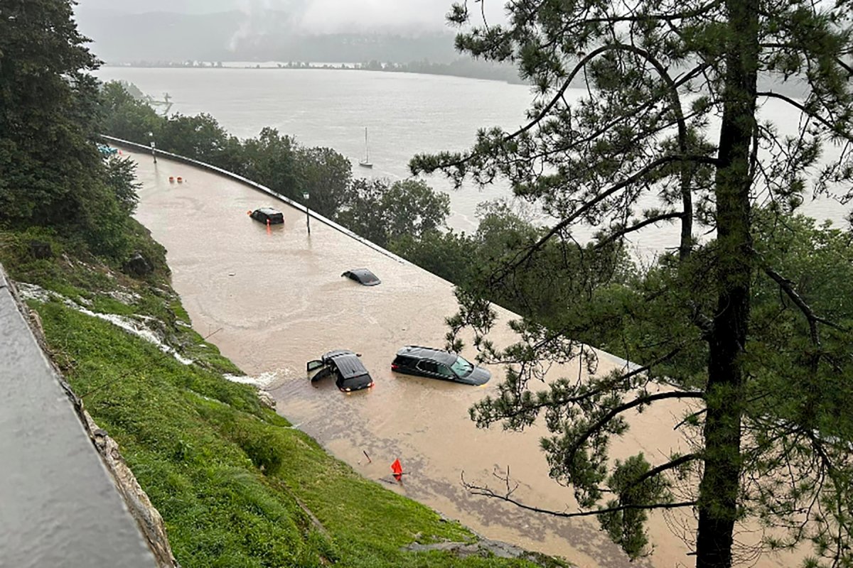 Cars sit stranded in standing flood water along Thayer Road on the campus of the United States Military Academy at West Point, Monday, July 10, 2023, in West Point, N.Y. Heavy rain washed out roads and forced evacuations Sunday in the northeast as more downpours were forecast throughout the day Monday. (Courtesy of the USMA via AP)