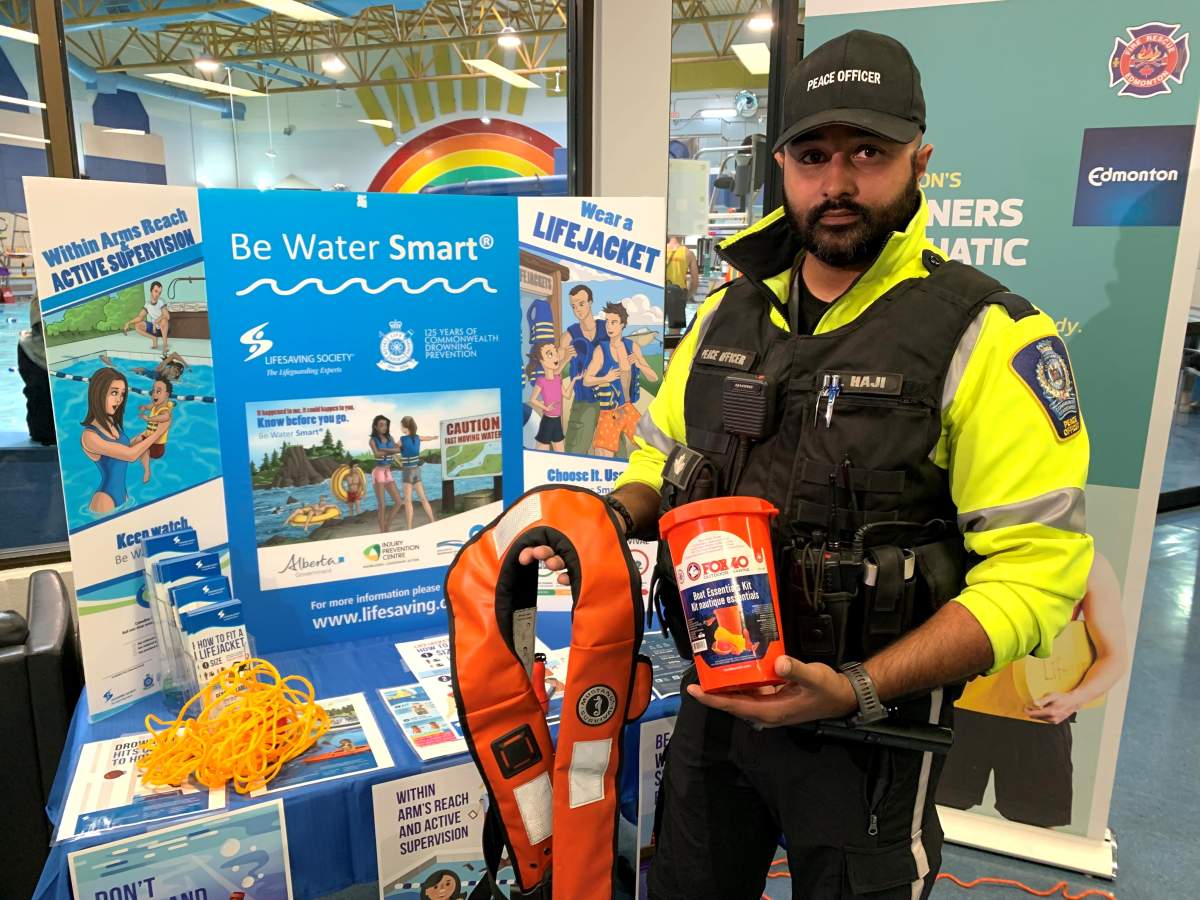 Zain Haji, an Edmonton park ranger with the marine unit, shows the required safety equipment needed to boat in the Edmonton area.
