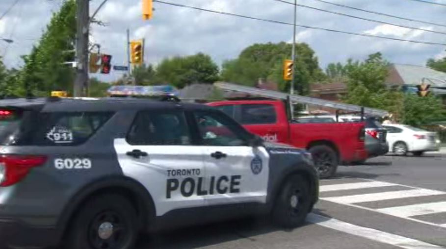 Police on scene after a pedestrian was hit by a red pickup truck in south Etobicoke on July 11, 2023.
