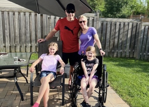 Grace Anstey, 9, with her family recovering after dislocating her knee.