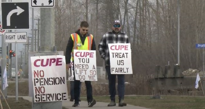 Members of CUPE Local 561 walk the picket line in this undated photo. 