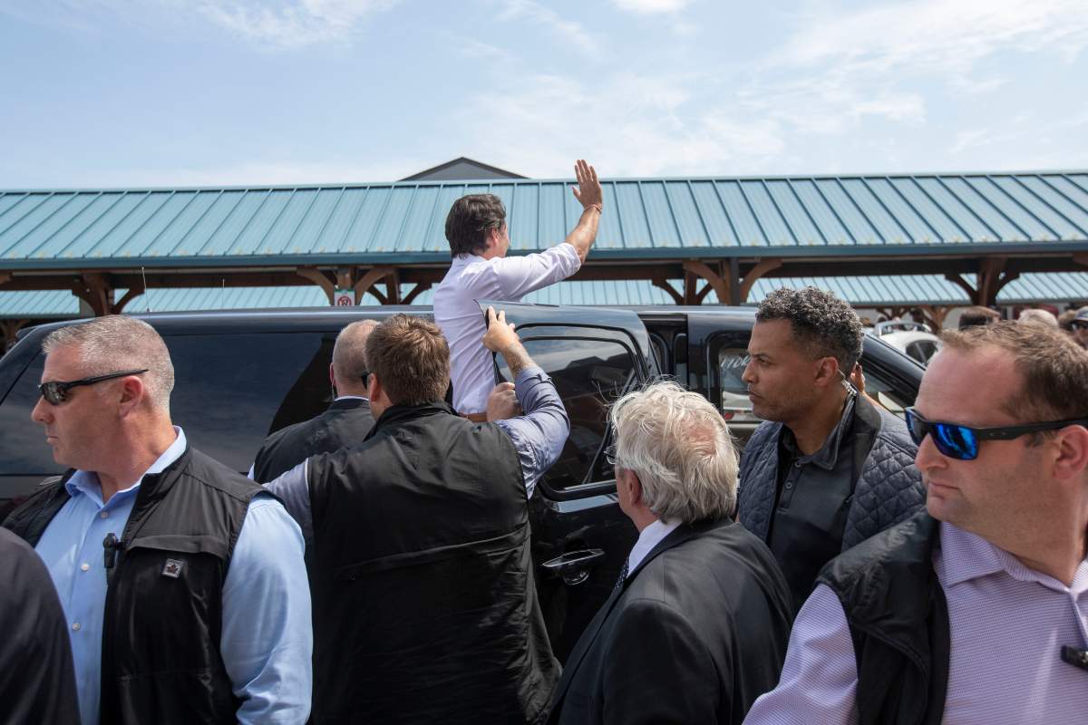 Prime Minister Justin Trudeau waves before leaving Belleville, Ontario, on Thursday July 20, 2023. THE CANADIAN PRESS/Lars Hagberg