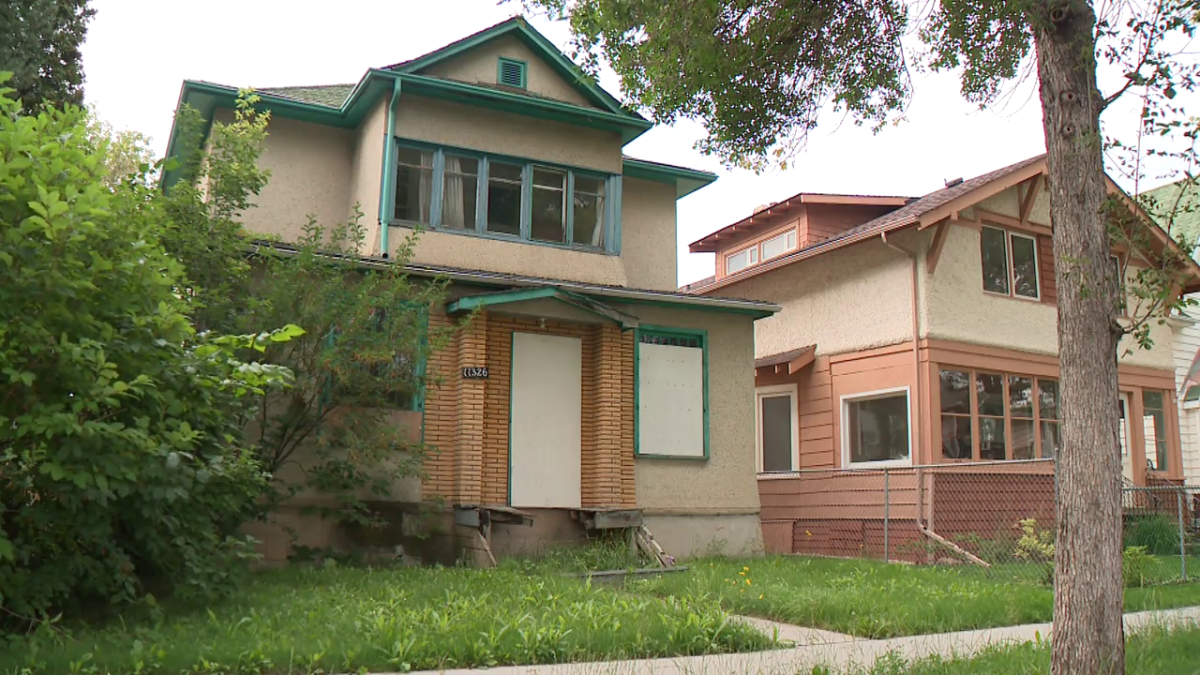 Dilapidated houses on Alberta Avenue are being boarded up to prevent safety issues, Saturday, July 29, 2023.
