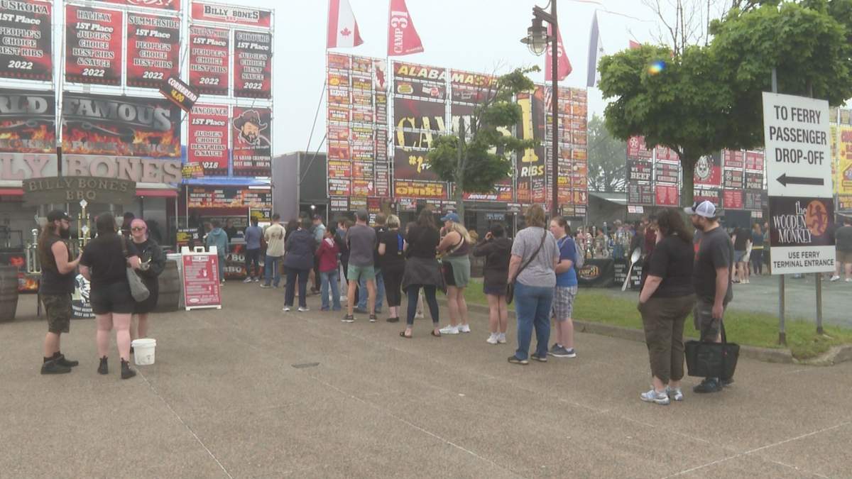 Attendees line up to get their hands on some ribs offered by one of the five unique vendors.