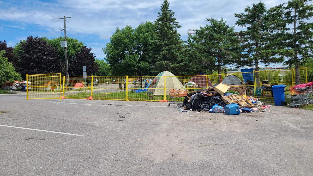 Construction fencing was installed at the site of a tent encampment on Wolfe Street on July 12, 2023.