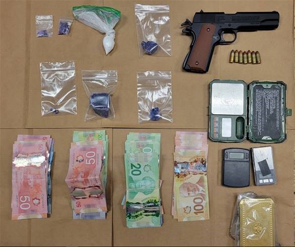 Police in Cobourg, Ont., arrested two after investigators seized drugs and an imitation firearm on Aug. 7, 2023.