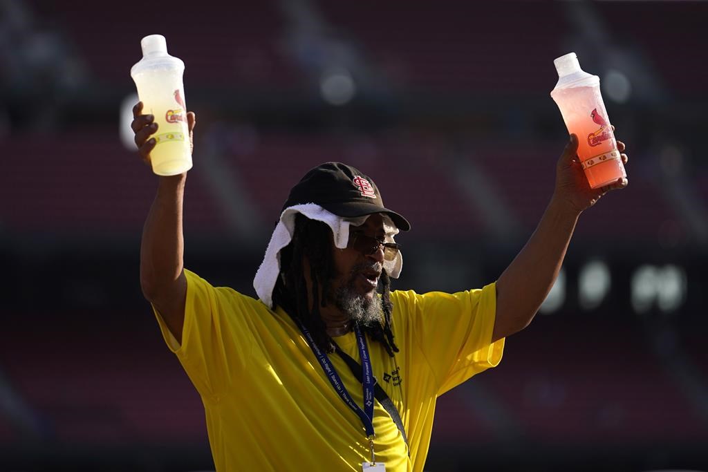 FILE – A vendor sells cold drinks before the start of a baseball game between the St. Louis Cardinals and the Chicago Cubs, July 28, 2023, in St. Louis. European climate monitoring organization made it official: July 2023 was Earth’s hottest month on record by a wide margin. (AP Photo/Jeff Roberson, File)