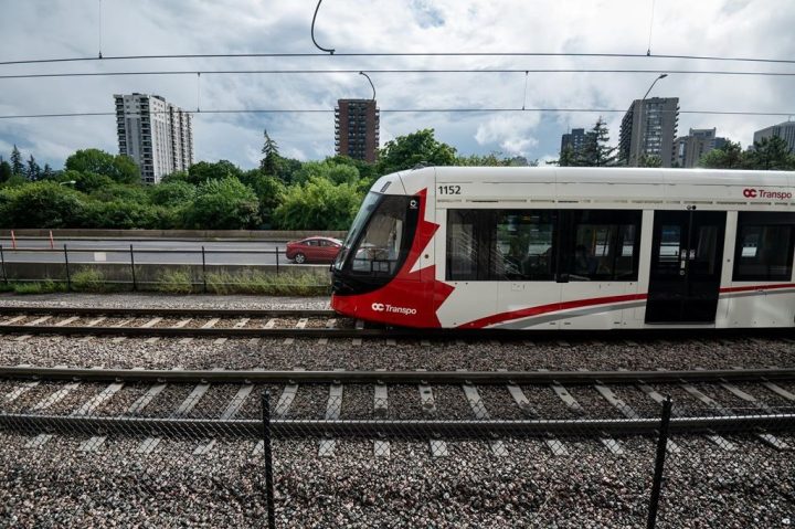 An Ottawa Light Rail Transit (LRT) train pulls into a station in Ottawa on Sunday, July 24, 2022. In a memo to Ottawa's council and the mayor, a public transit official says the city's latest light-rail transit expansion will be pushed past at least early November. 
