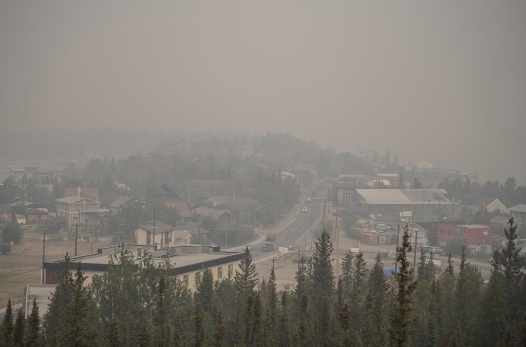 Heavy smoke from nearby wildfires fills the sky in Yellowknife on Tuesday, August 15, 2023.